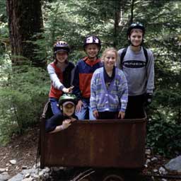 Kids standing together in mining cart